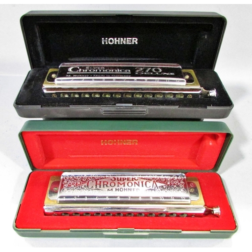 562 - A collection of seven harmonicas, including two Stan Harper Hering Chromatic 56’s, a Hering 5148, a ... 