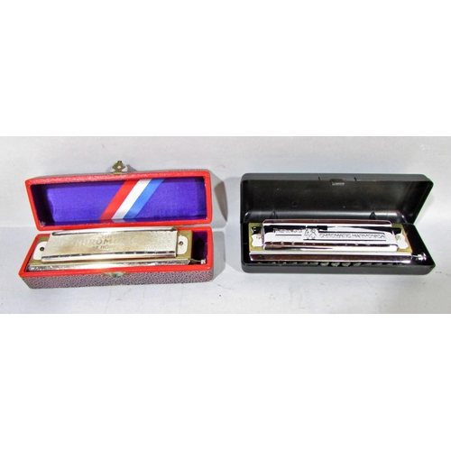 562 - A collection of seven harmonicas, including two Stan Harper Hering Chromatic 56’s, a Hering 5148, a ... 