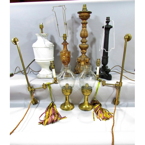 601 - A pair of brass candlesticks with smoked glass shades, together with a classical column lamp on hair... 