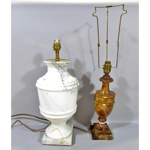 601 - A pair of brass candlesticks with smoked glass shades, together with a classical column lamp on hair... 