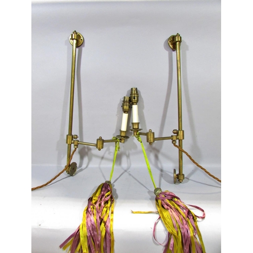 601 - A pair of brass candlesticks with smoked glass shades, together with a classical column lamp on hair... 