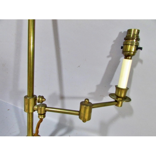 601 - A pair of brass candlesticks with smoked glass shades, together with a classical column lamp on hair... 