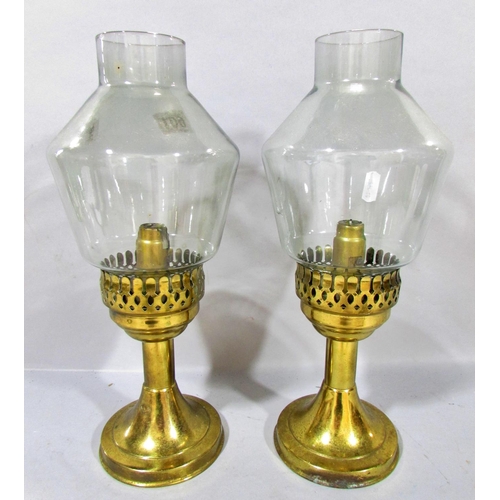 601 - A pair of brass candlesticks with smoked glass shades, together with a classical column lamp on hair... 