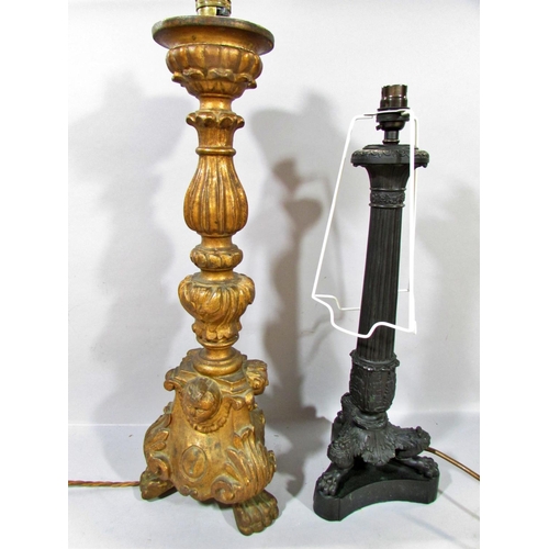 601 - A pair of brass candlesticks with smoked glass shades, together with a classical column lamp on hair... 