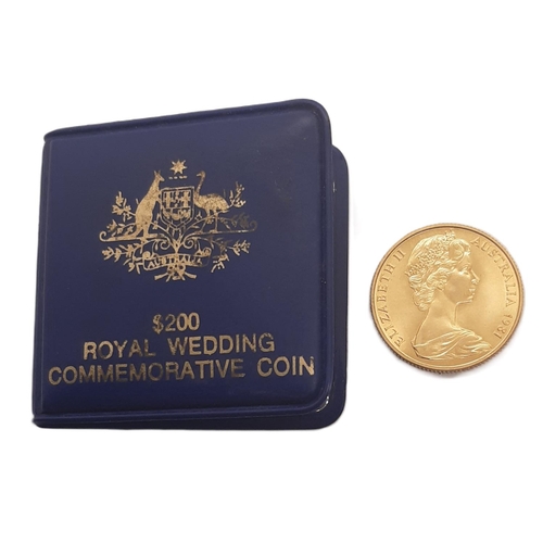 852 - Elizabeth II (1952 - 2022) A gold two hundred dollar coin, H.R.H The Prince of Wales and Lady Diana ... 