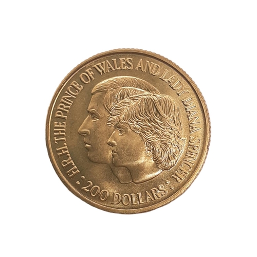 852 - Elizabeth II (1952 - 2022) A gold two hundred dollar coin, H.R.H The Prince of Wales and Lady Diana ... 