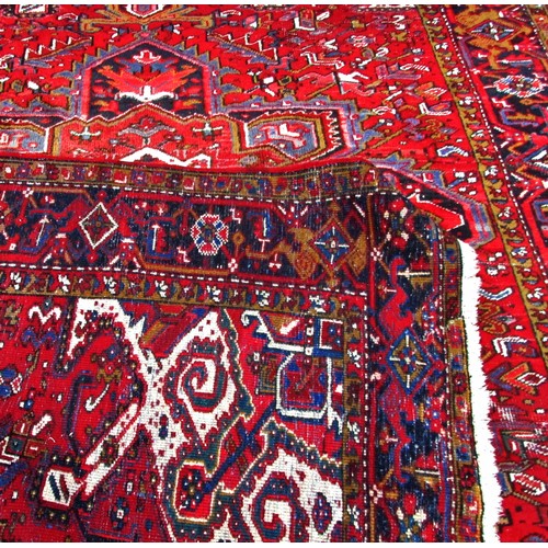 1783 - An old Azerbaijan carpet with a central radiating medallion on a predominantly red ground, faded at ... 