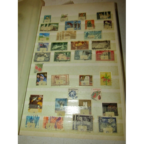 744 - Two boxes containing mixed worldwide stamps in several homemade albums and a stockbook, a large numb... 