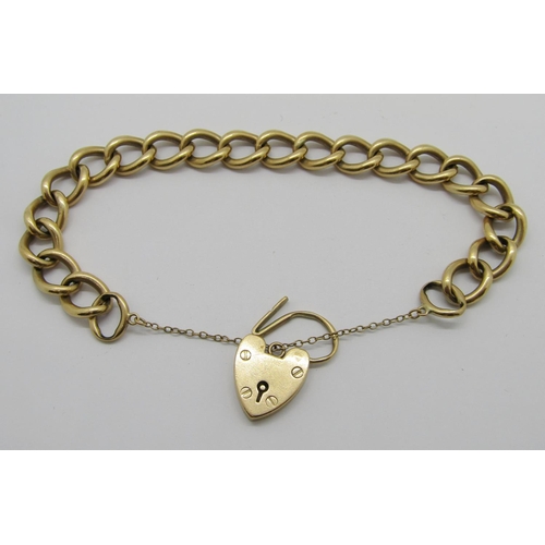 323 - 9ct curb link bracelet with heart padlock clasp, 36.4g