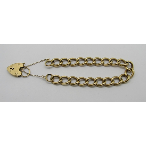 323 - 9ct curb link bracelet with heart padlock clasp, 36.4g