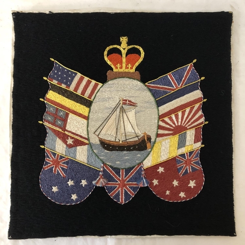 1929 - British sailor's woolwork embroidered panel of a ship of the Royal Navy surrounded by nation's flags... 