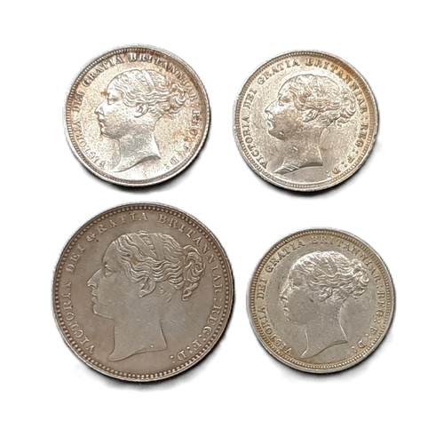 885 - Victoria (1837 - 1901) a silver shilling coin, 1888, together with three 6d coins, 1881, 1884 and 18... 