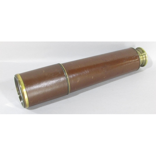 519 - A, B.C & Co Ltd London E.C.I three draw leather bound brass telescope, with original leather lens ca... 