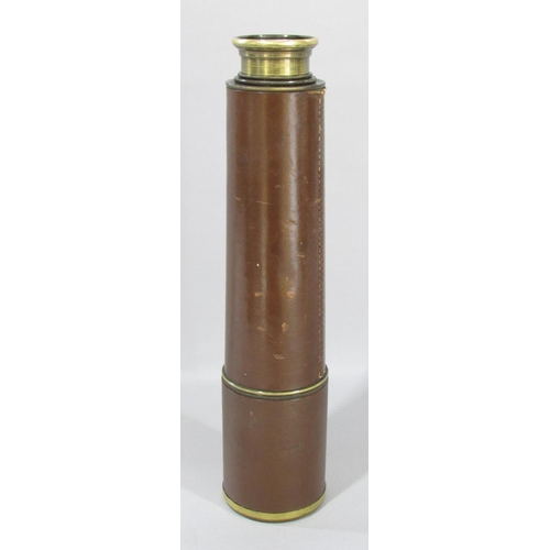 519 - A, B.C & Co Ltd London E.C.I three draw leather bound brass telescope, with original leather lens ca... 