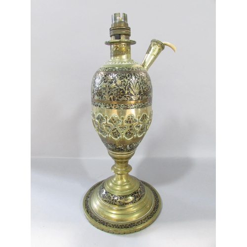 526 - A pair of Middle Eastern converted brass hookah pipes to electric lamps, both richly engraved with f... 