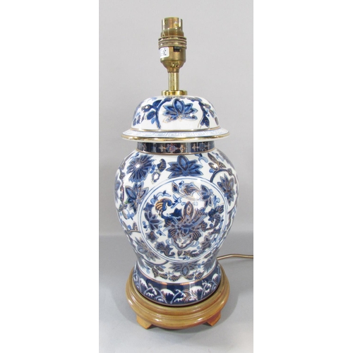 529 - A modern blue and white Chines style ginger jar lamp, another white and floral similar lamp, a Europ... 