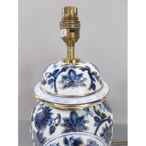 529 - A modern blue and white Chines style ginger jar lamp, another white and floral similar lamp, a Europ... 