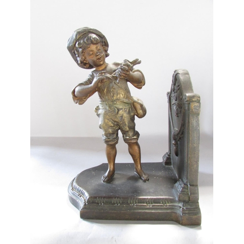 534 - A pair of painted spelter bookends one with boy and the other a girl 15cm wide.