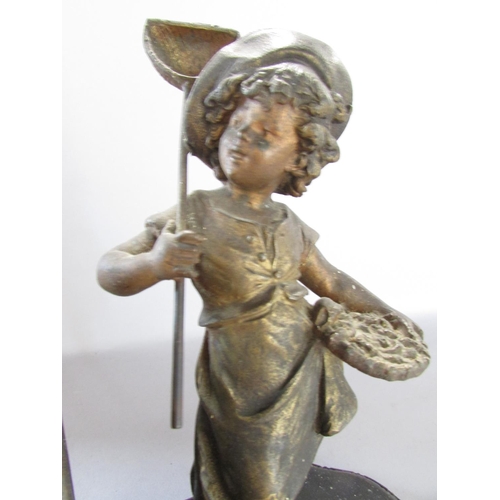 534 - A pair of painted spelter bookends one with boy and the other a girl 15cm wide.