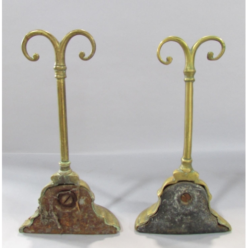 538 - A pair of 19th century brass door stops weighted with cast iron, 24.5 cm high