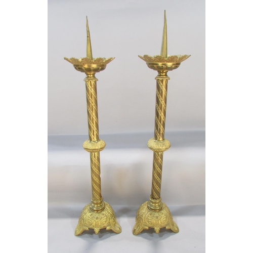 548 - A pair of Victorian Gothic ecclesiastical candlesticks, 60cm tall.