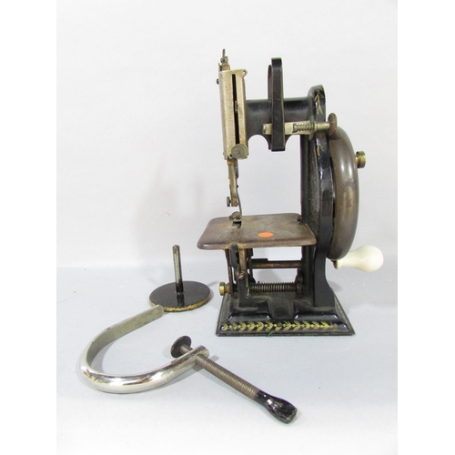 554 - A Dorman Lockstitch Sewing Machine, in need of restoration, in an old box, 20cm high