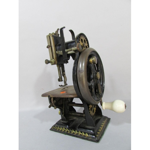 554 - A Dorman Lockstitch Sewing Machine, in need of restoration, in an old box, 20cm high