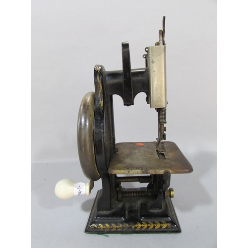 554 - A Dorman Lockstitch Sewing Machine, in need of restoration, in an old box, 20cm high