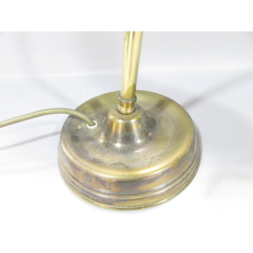 558 - An Edwardian brass reading lamp with a shell shade on a flexible arm.