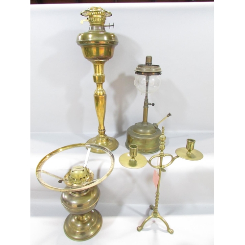 559 - A19th century brass adjustable candlestick raised on tripod paw supports, 38cm high, together with a... 