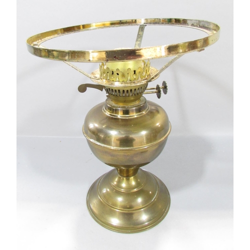 559 - A19th century brass adjustable candlestick raised on tripod paw supports, 38cm high, together with a... 