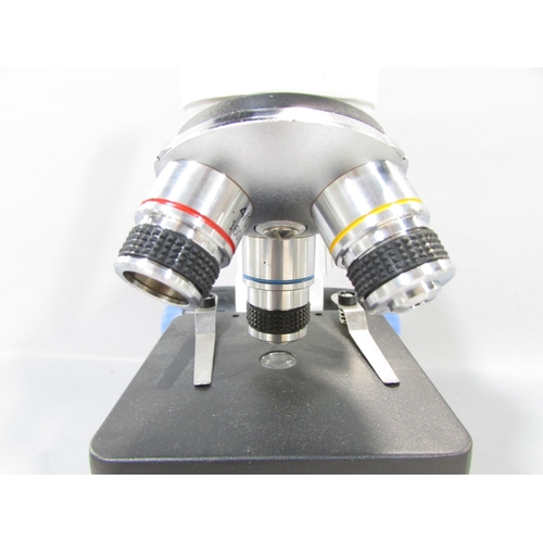 567 - A Swift Model SW150 Triple Revolving Microscope with upper and lower illumination, in near new condi... 