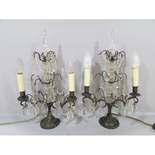 574 - A pair of converted cut glass and bronze candelabra  with a central column of glass baubles hung wit... 