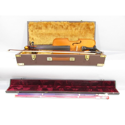 579 - A hand made unconventional violin, with a squared off body with a bird carved scroll, made by Willia... 