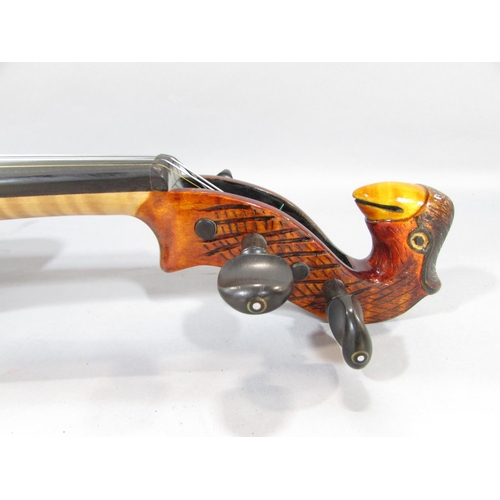 579 - A hand made unconventional violin, with a squared off body with a bird carved scroll, made by Willia... 