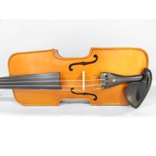 579 - A hand made unconventional violin, with a squared off body with a bird carved scroll, made by Willia... 