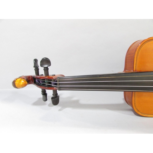 579 - A hand made unconventional violin, with a squared off body with a bird carved scroll, made by Willia... 