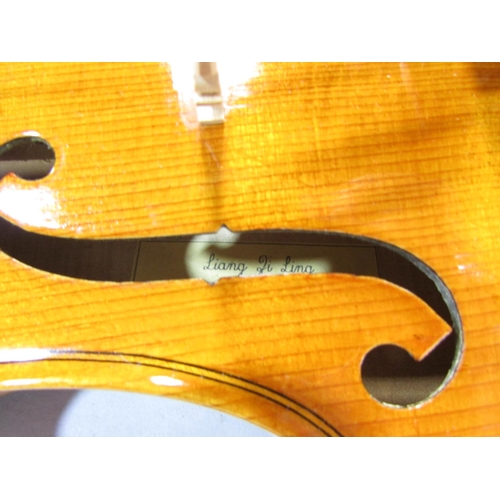 581 - A late 20th century Chinese made violin, bearing a label inside Liang Ji Ling Guangzhou, 50cm overal... 