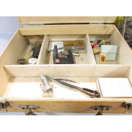 584 - A Fly Fisherman’s Tying Box with a small clamp, tweezers, file, a selection of different coloured co... 