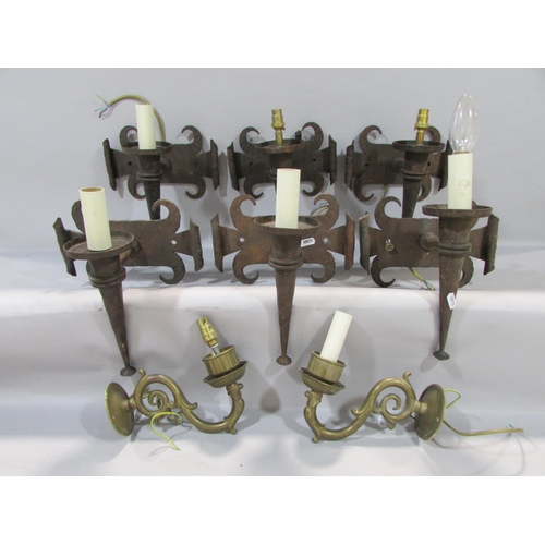 603 - Six Chateauesque wrought iron torch wall lights with scrolled back plates and two scrolled wall ligh... 