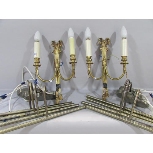 604 - A pair of Regency style gilt swag and bow wall lights, a gold contemporary wall light with overlappi... 