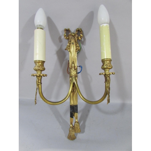 604 - A pair of Regency style gilt swag and bow wall lights, a gold contemporary wall light with overlappi... 