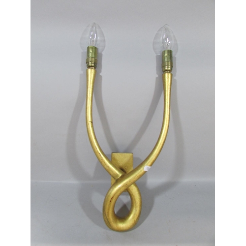 604 - A pair of Regency style gilt swag and bow wall lights, a gold contemporary wall light with overlappi... 