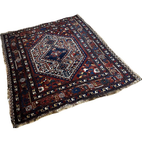 1766 - An old tribal Qashgai Persian rug with a central medallion with stylised flowers , 190 x 156cm appro... 