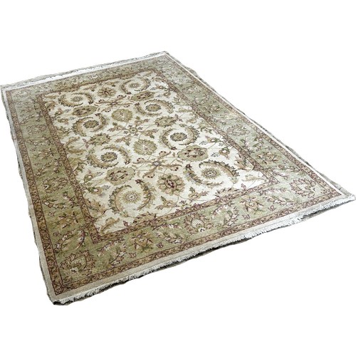 1774 - A Zeigler design carpet with an all over floral and frond pattern on a cream ground, 250cm x 170cm a... 