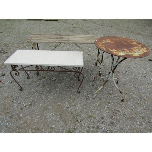 1077 - A low iron work garden / conservatory table of rectangular form, raised on open scrolled supports be... 