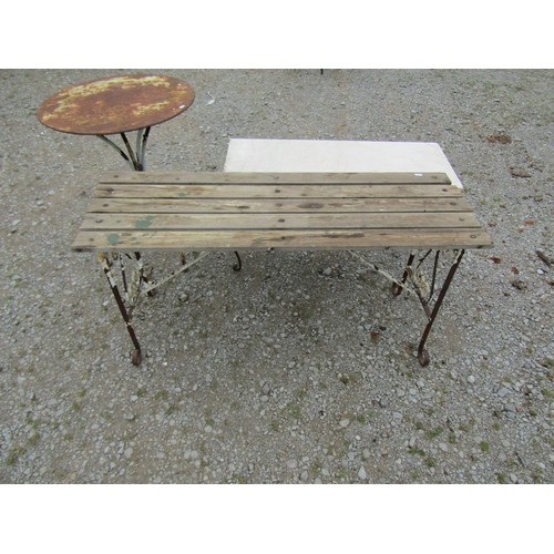 1077 - A low iron work garden / conservatory table of rectangular form, raised on open scrolled supports be... 