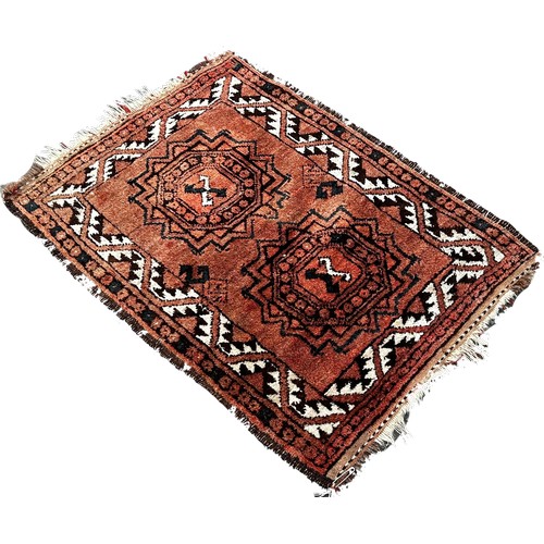 1756 - An Afghan prayer mat with two waisted medallions and another small Afghan mat 105cm x 75cm and 90cm ... 