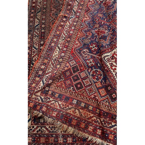 1754 - An antique Persian rug with three interlocking diamond medallions in the centre, 195cm x 146cm appro... 