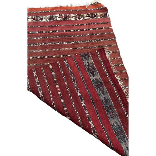 1753 - An Afghan red and black ground kilim 175cm x 106cm approximately